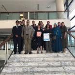 Delegates of the Arab World Meeting pose on the steps of the Library